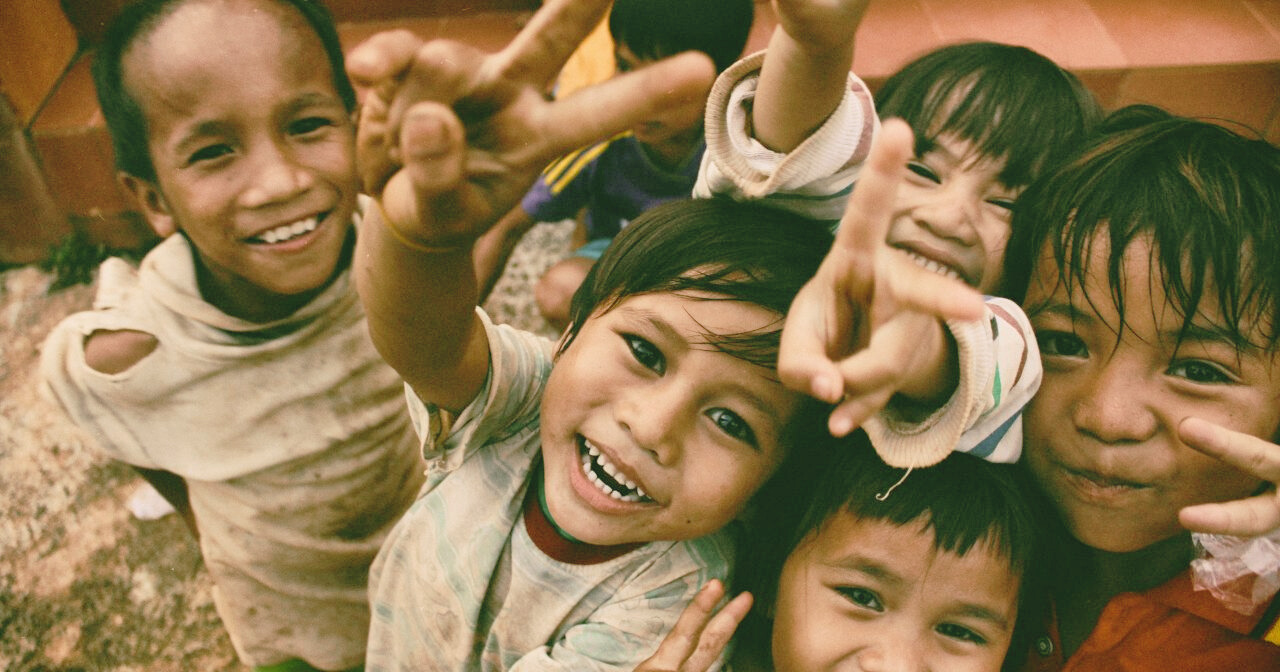 Happy children making peace signs